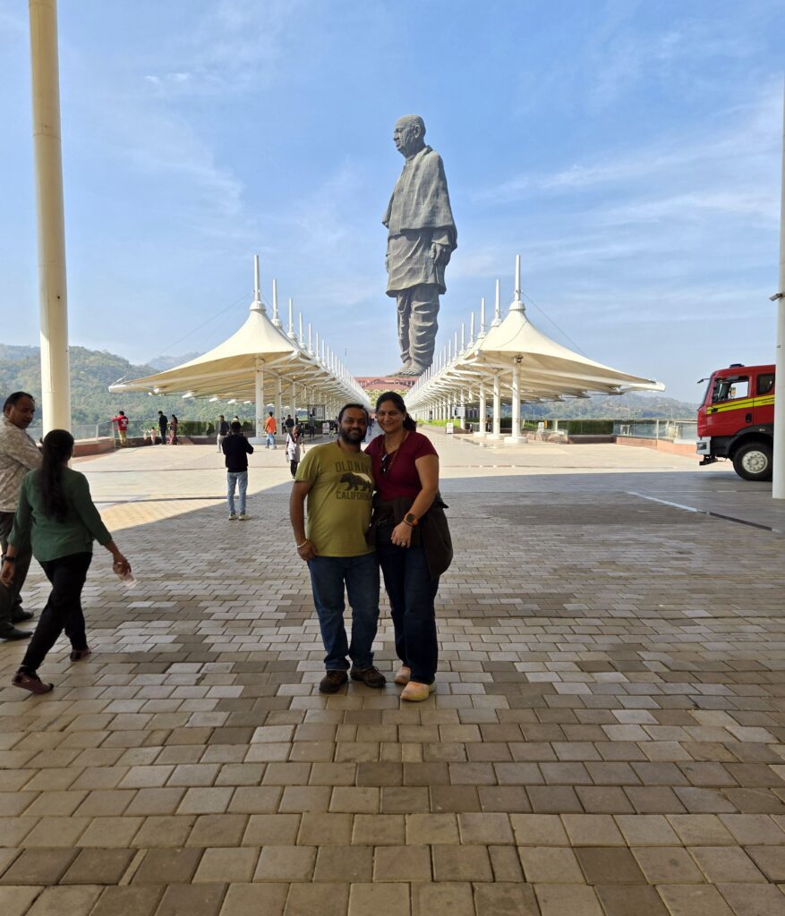 Yogesh and Ruby together beneath the Statue of Unity in Gujarat