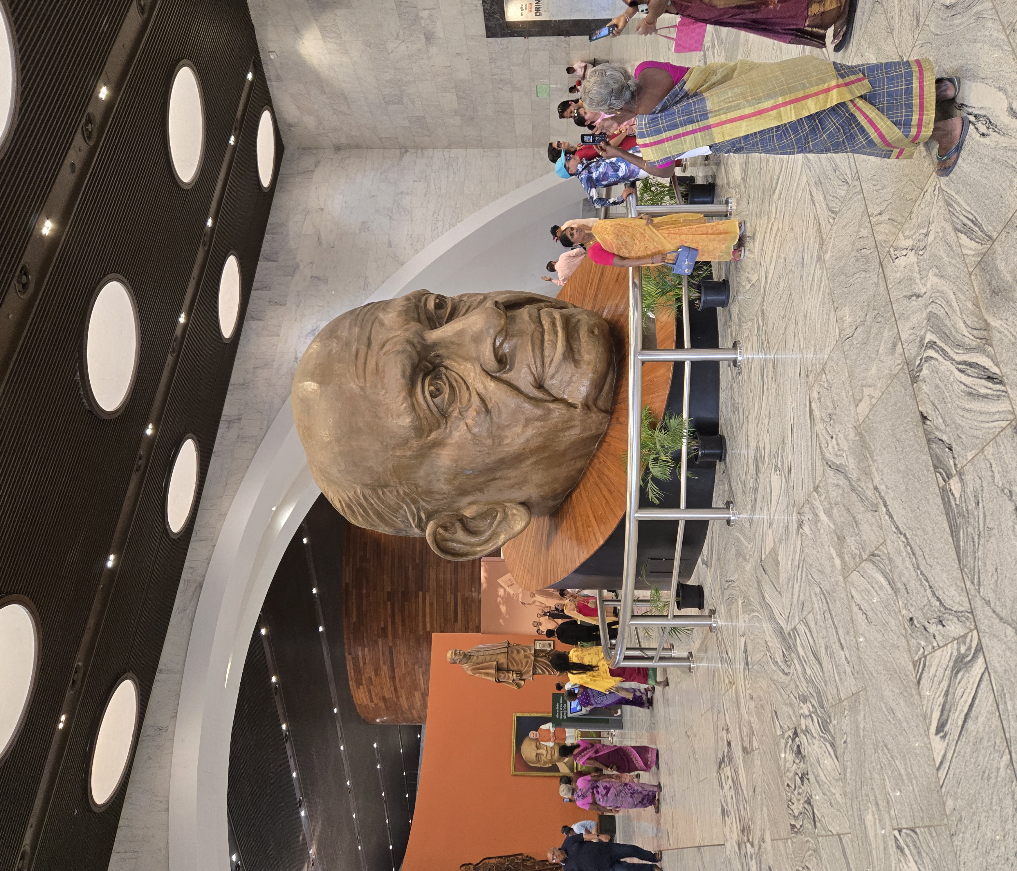 Visitors viewing a monumental sculpted head of Sardar Vallabhbhai Patel inside the museum