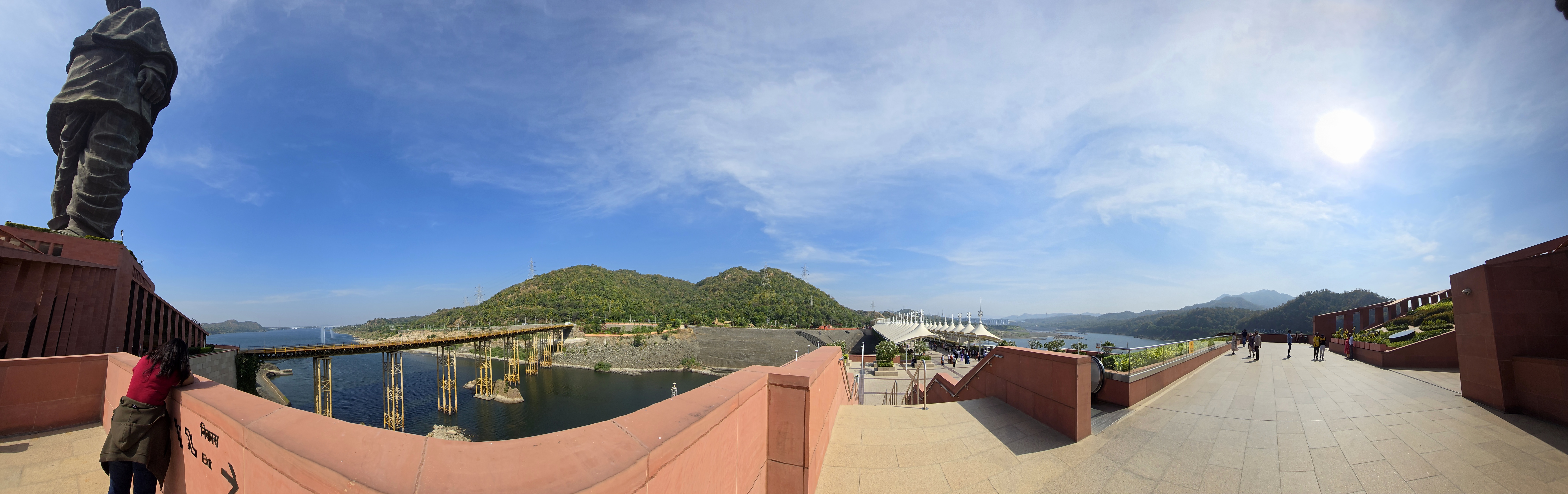 Panoramic view of the water, bridge and hills from the Statue of Unity complex