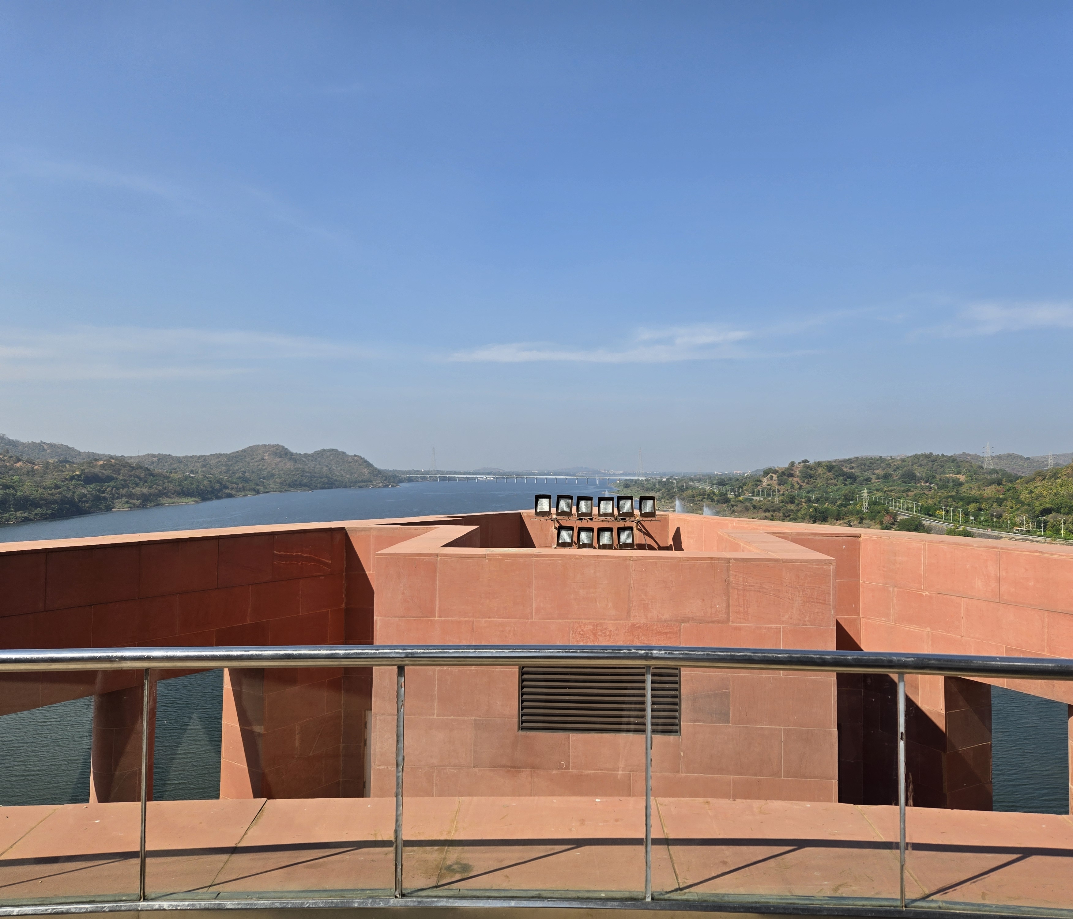 Reservoir and green hills seen from a viewing platform at the Statue of Unity