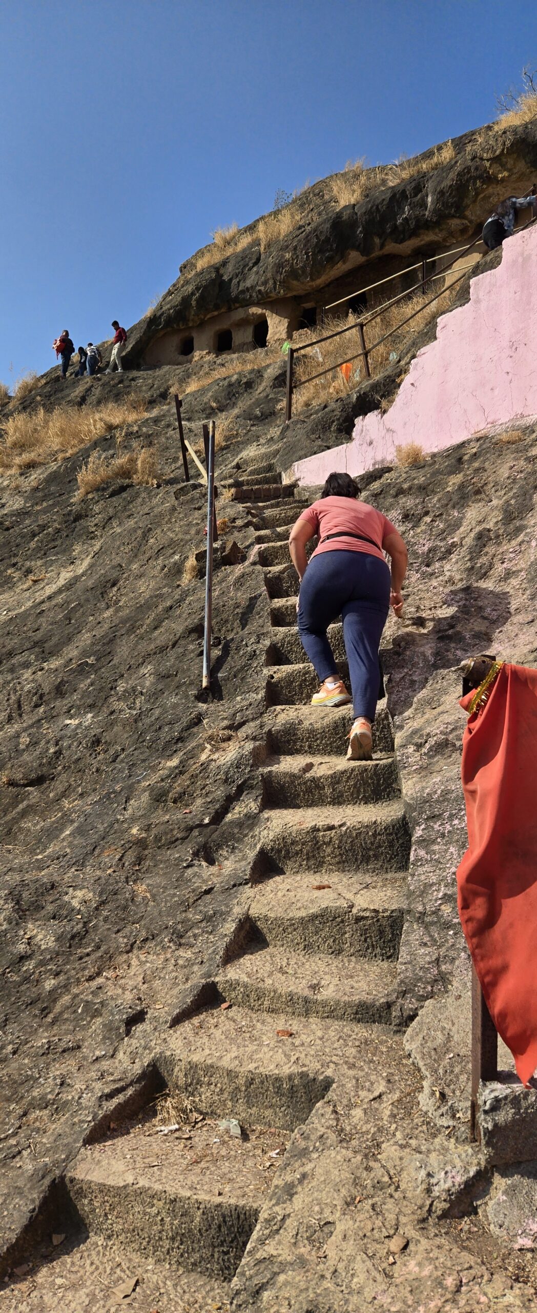 Ruby climbing natural stone steps carved into Kadia Dungar
