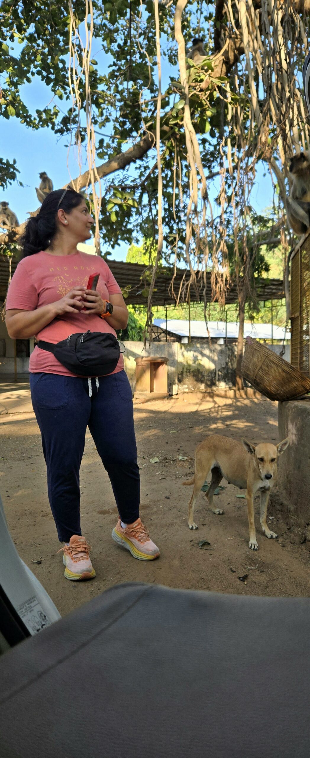 Ruby standing beside a friendly dog after the Kadia Dungar climb