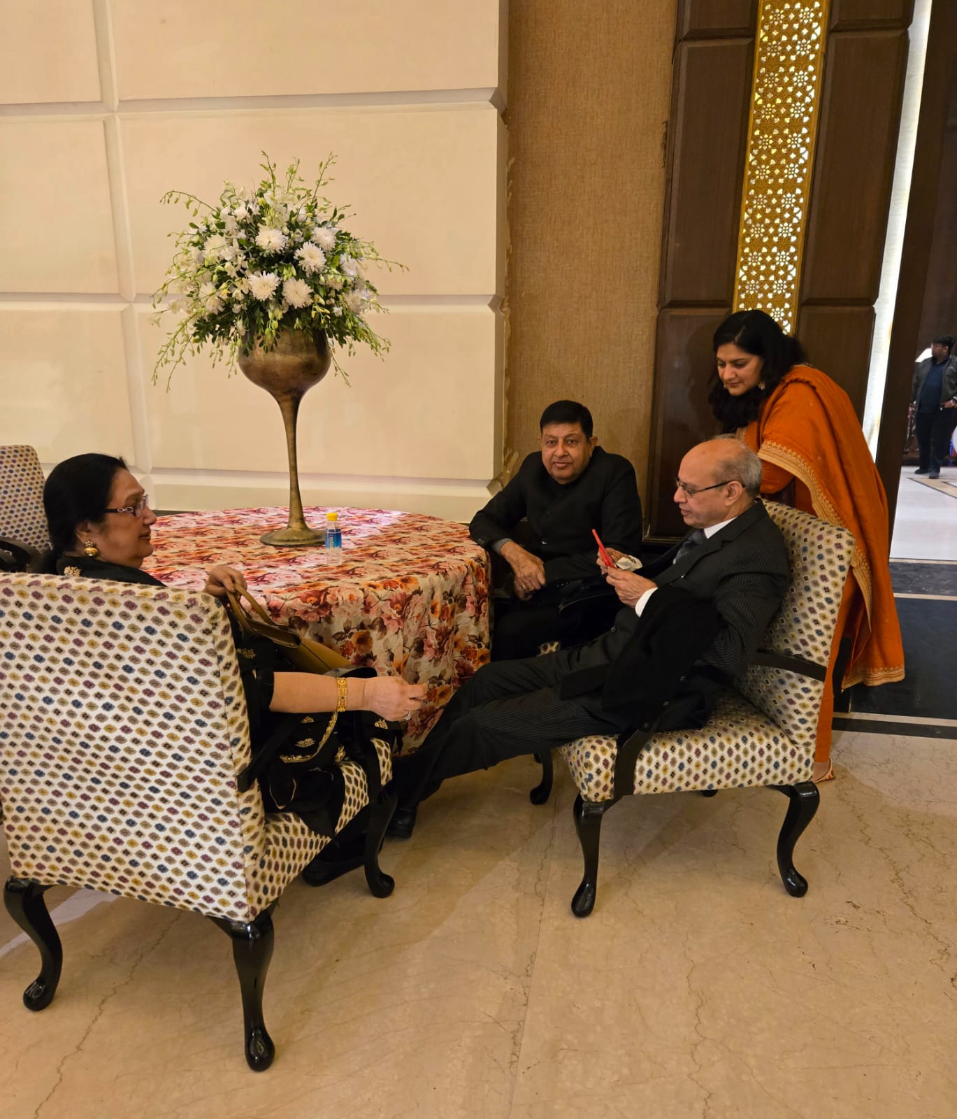 Ruby's dad introducing Yogz to relatives at a wedding reception in Ludhiana