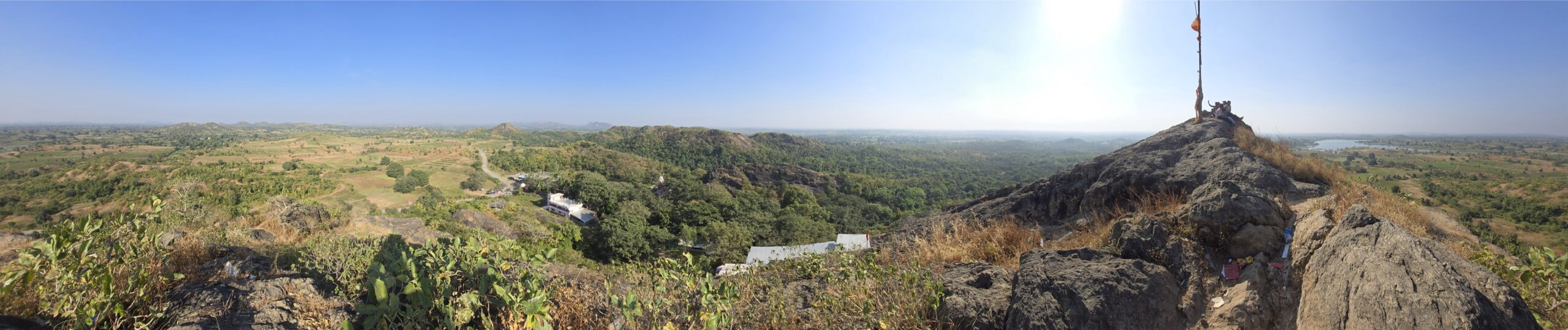 Panoramic view of the surrounding hills and green landscape from the summit of Kadia Dungar